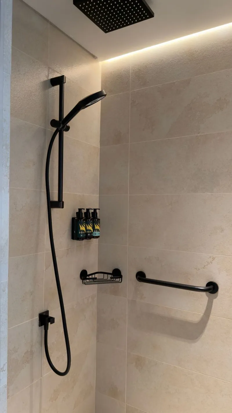 Tiled shower with black hardware