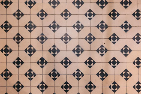 Geometric black-and-white patterned floor tiles